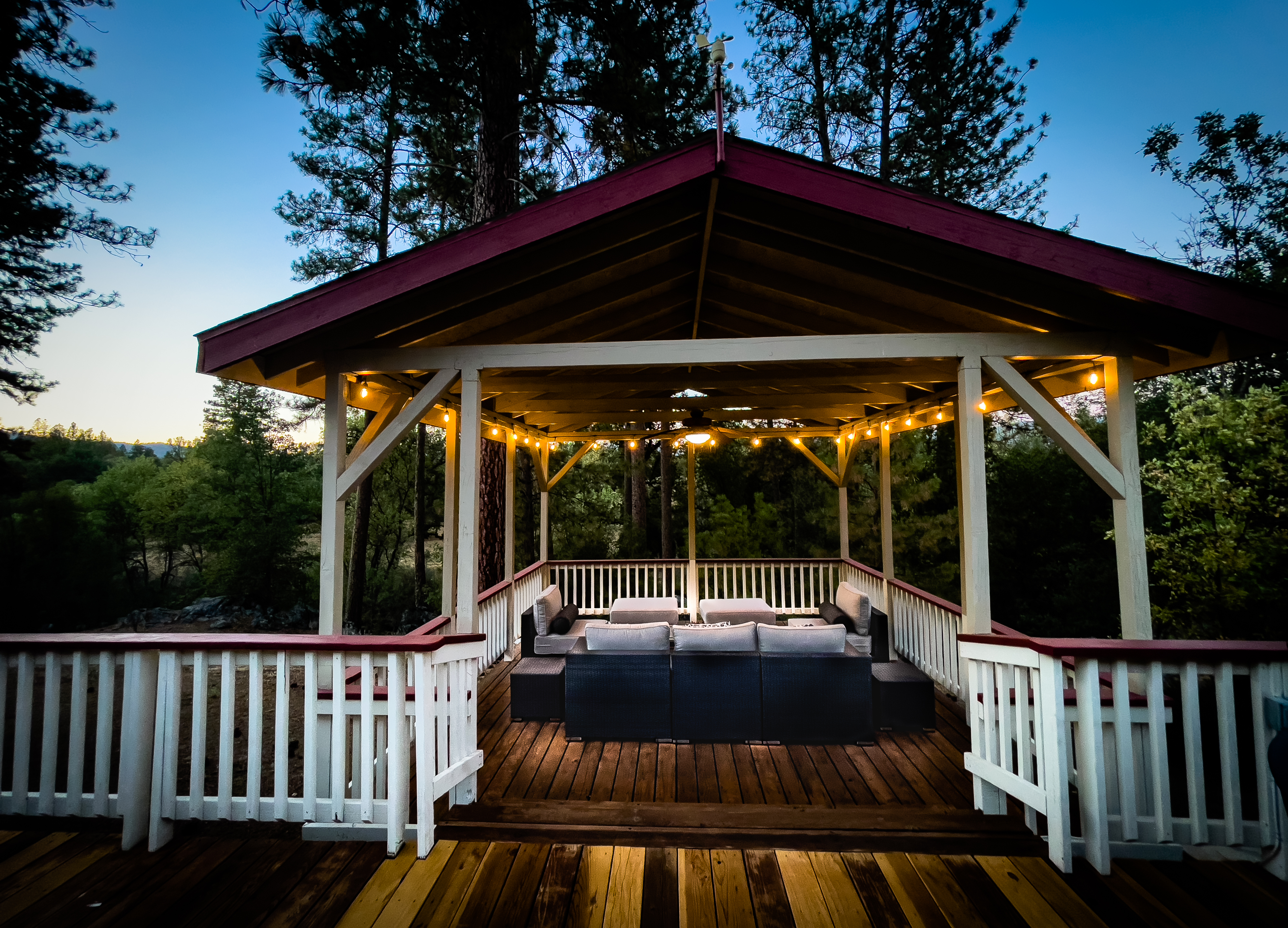 Watch sun setting beyond the trees while you relax in the deck.